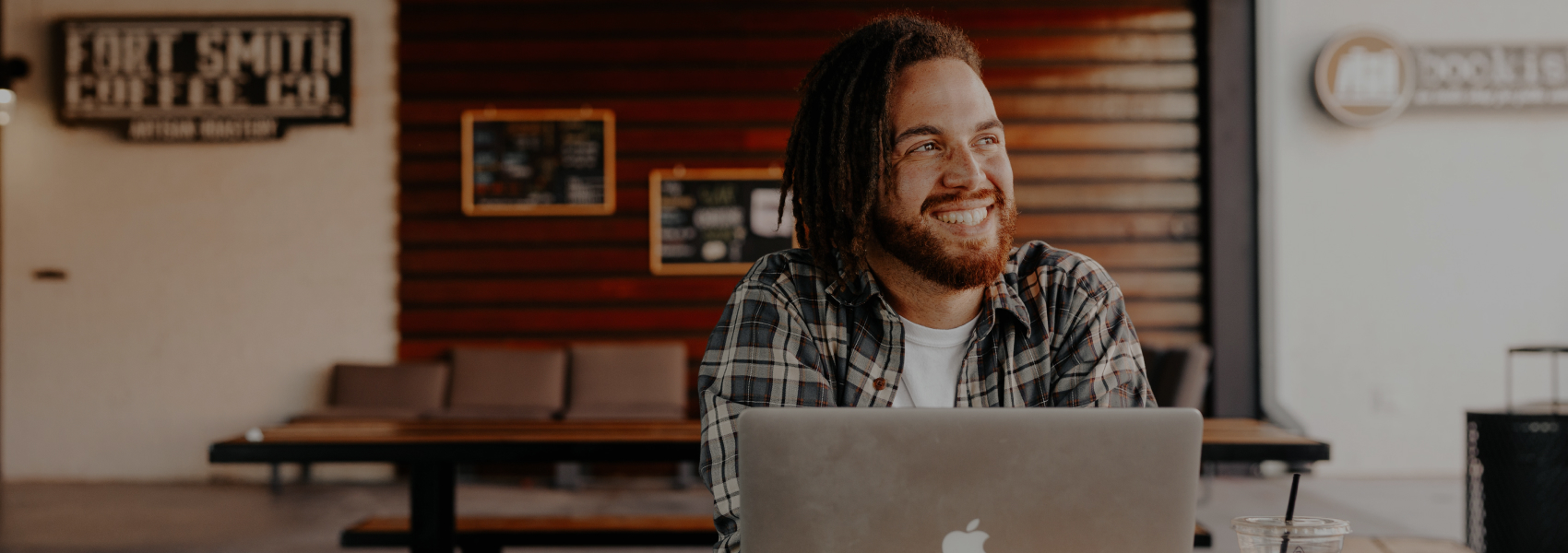 Man smiling with laptop